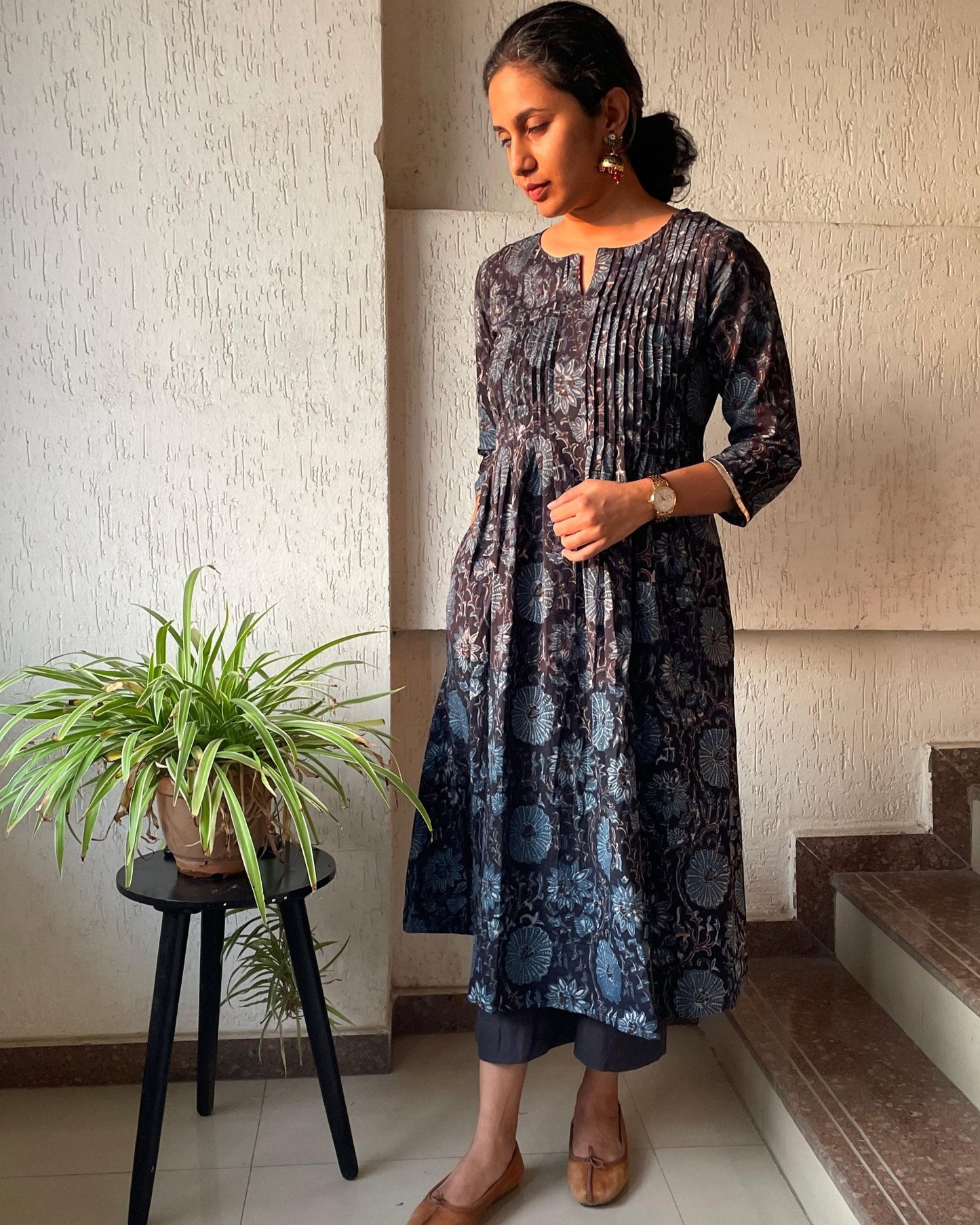 Black ajrakh cotton kurta for women with pintuck detailing on the front and 3/4th sleeves.