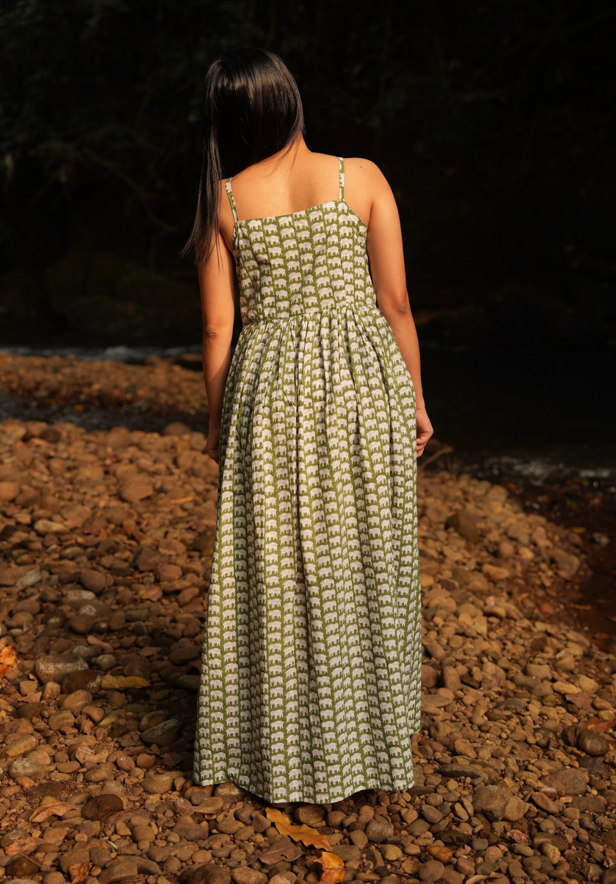 Enjoy elegance of our olive-green casual cotton maxi dress. Experience the beauty of hand-block prints and adjustable spaghetti straps. Featuring a side slit and pocket for convenient, everyday comfort.

