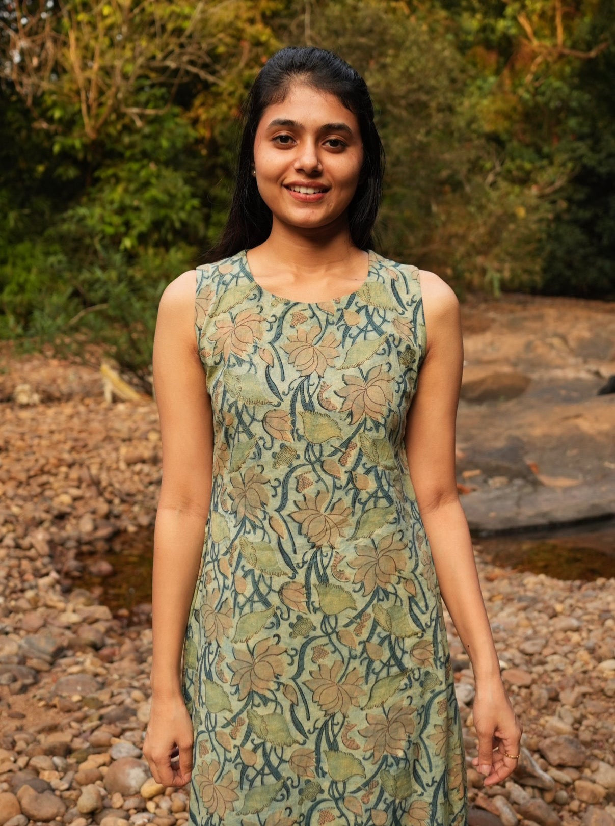 Shop this sleeveless maxi frock design for a comfortable, breezy look. Unique hand-printed Dabu patterns in soft cotton.