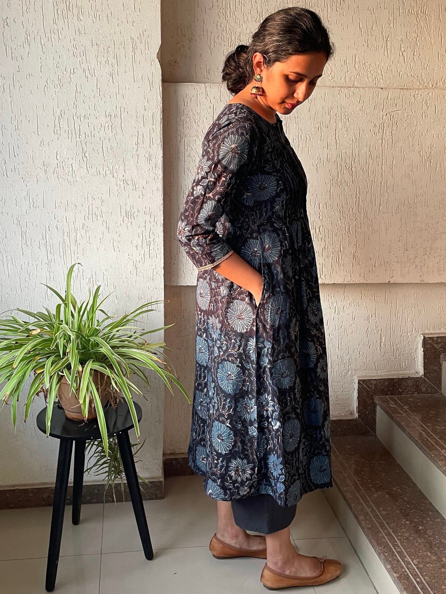 Black ajrakh cotton kurta for women with pintuck detailing on the front and 3/4th sleeves.