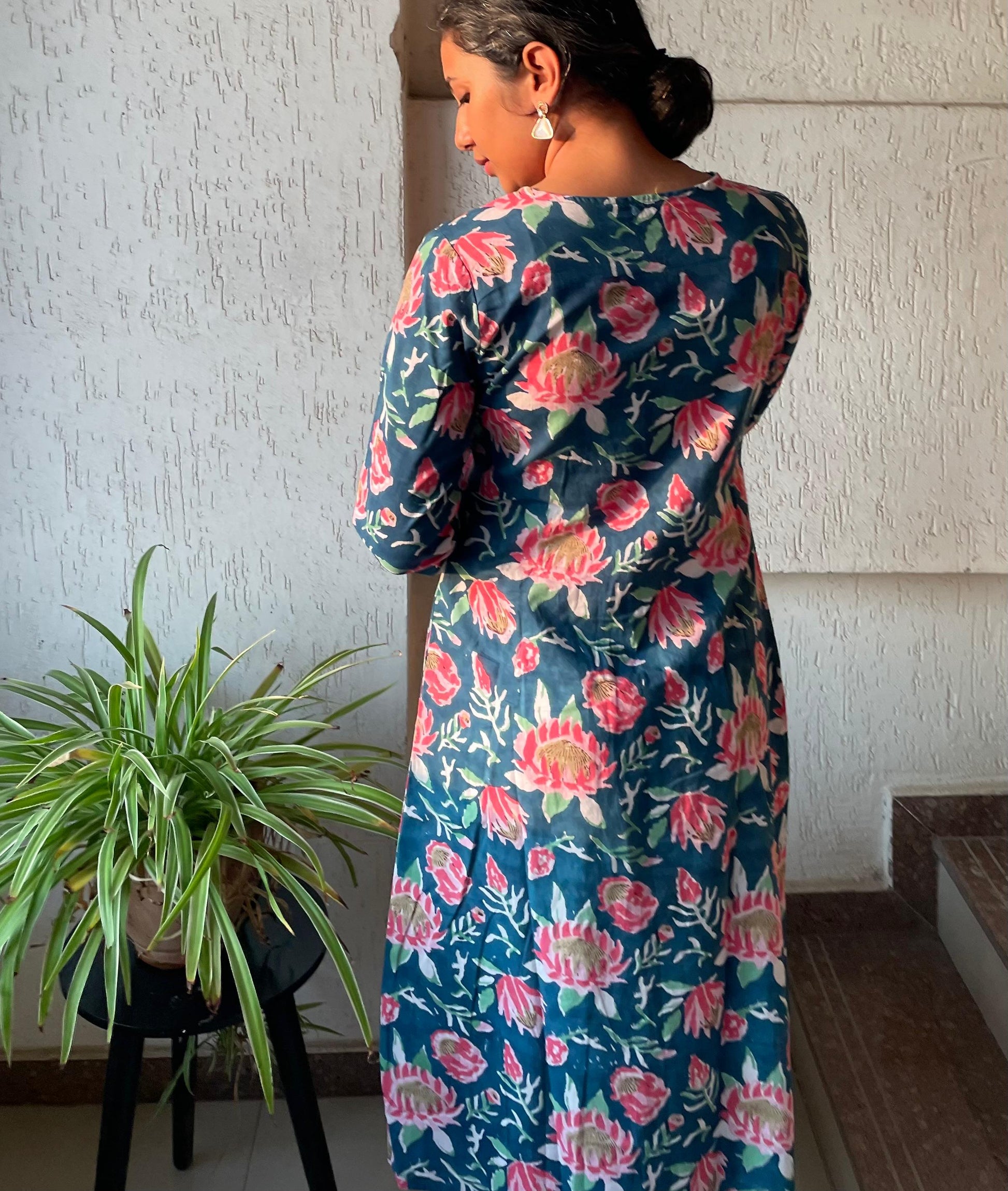 Buy pure cotton kurtas online. This floral kurta with pintuck detailing and sleeves are perfect for summer.