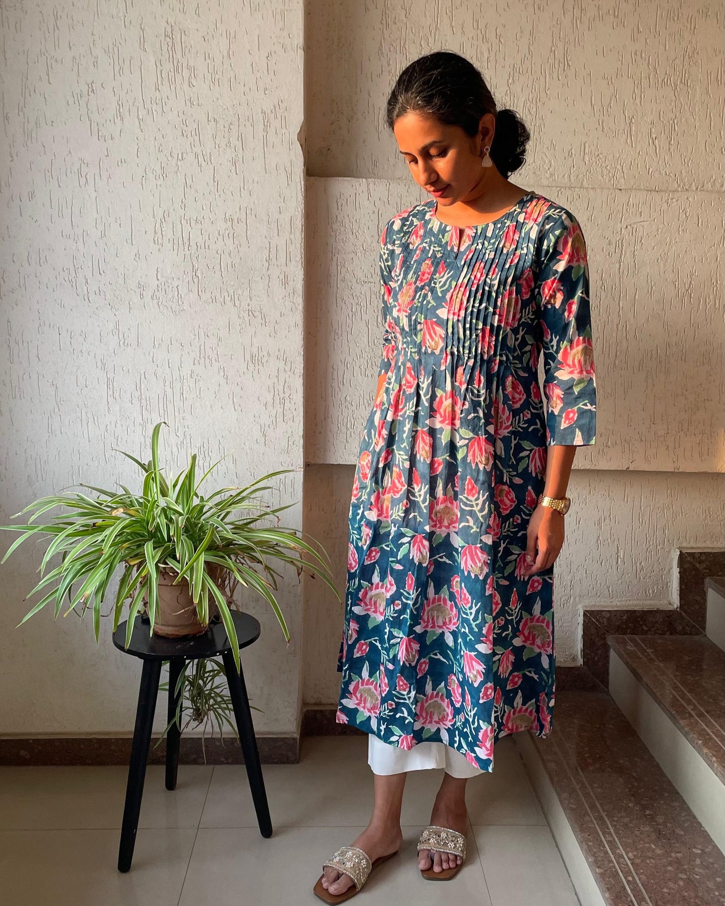 Buy pure cotton kurtas online. This floral kurta with pintuck detailing and sleeves are perfect for summer.