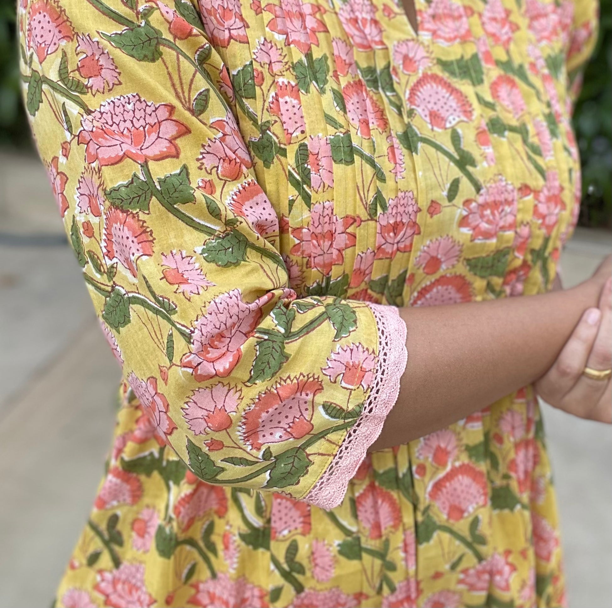 Shop best cotton kurta for summer. Yellow cotton hand block print kurta, with sleeve detailing with lace, pintucks on the front, and pockets on both sides.