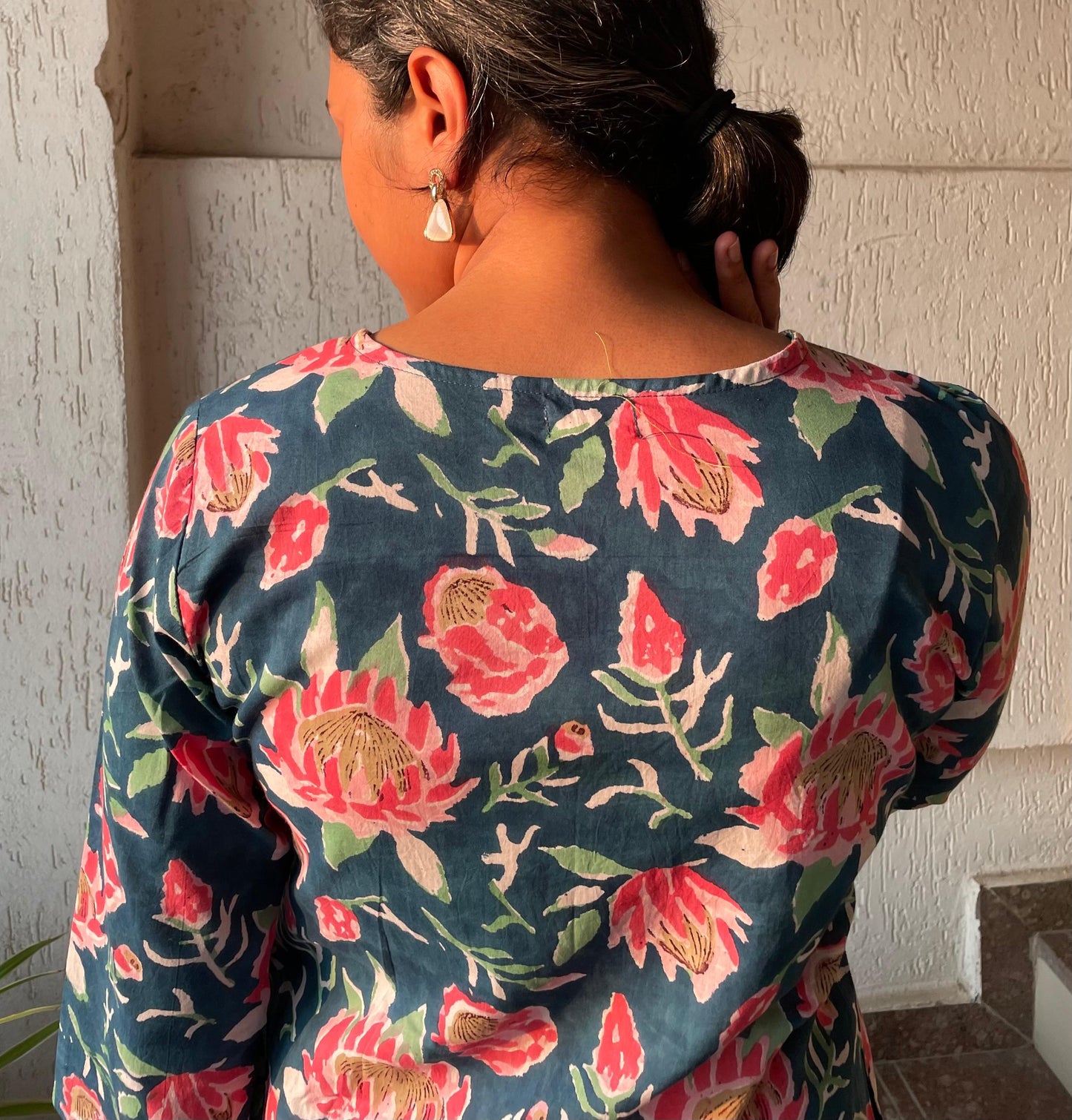 Buy pure cotton kurtas online. This floral kurta with pintuck detailing and sleeves are perfect for summer.