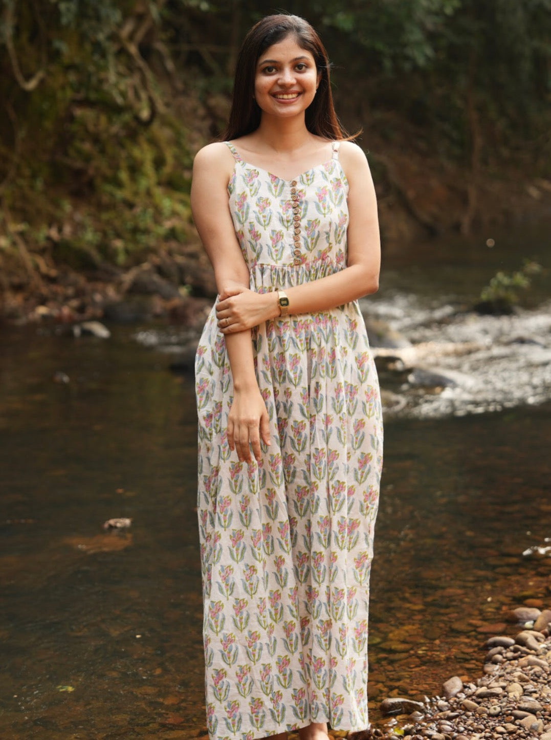 Here is the perfect long cotton dress! Handcrafted with adjustable straps, a comfortable smocked back, and a side slit for easy movement. Shop Now!