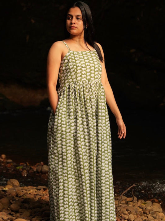 Olive green hand block printed sleeveless strap dress. Enjoy elegance of our casual cotton maxi dress. Experience the beauty of hand-block prints and adjustable straps. Featuring a side slit and pocket for convenient, everyday comfort.