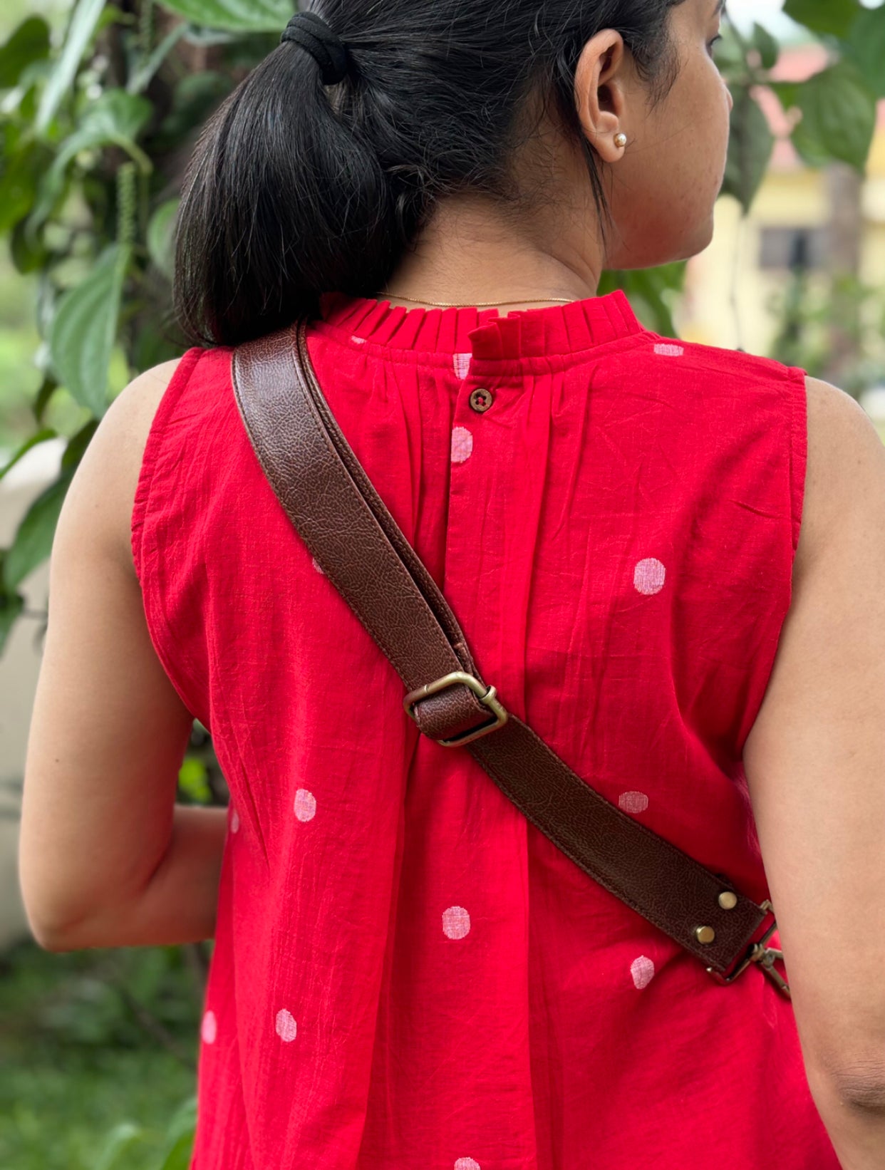 Red Jamdani dress. This red handwoven piece features intricate pintuck detailing. Experience the luxury of traditional Jamdani craftsmanship. Shop now