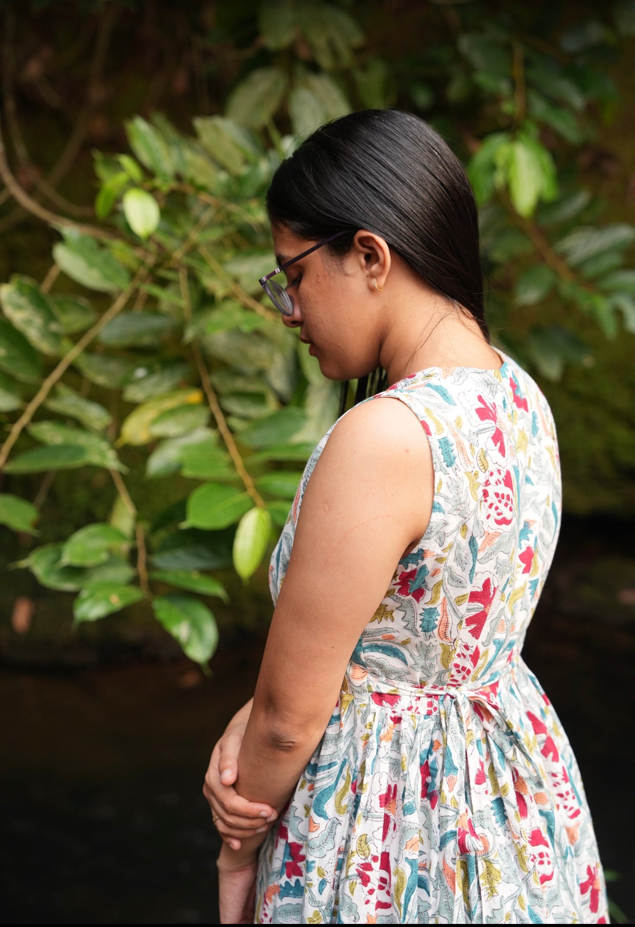simple cotton wrap dress for women. This dress is midi length and is sleeveless, with floral hand block printed designs.