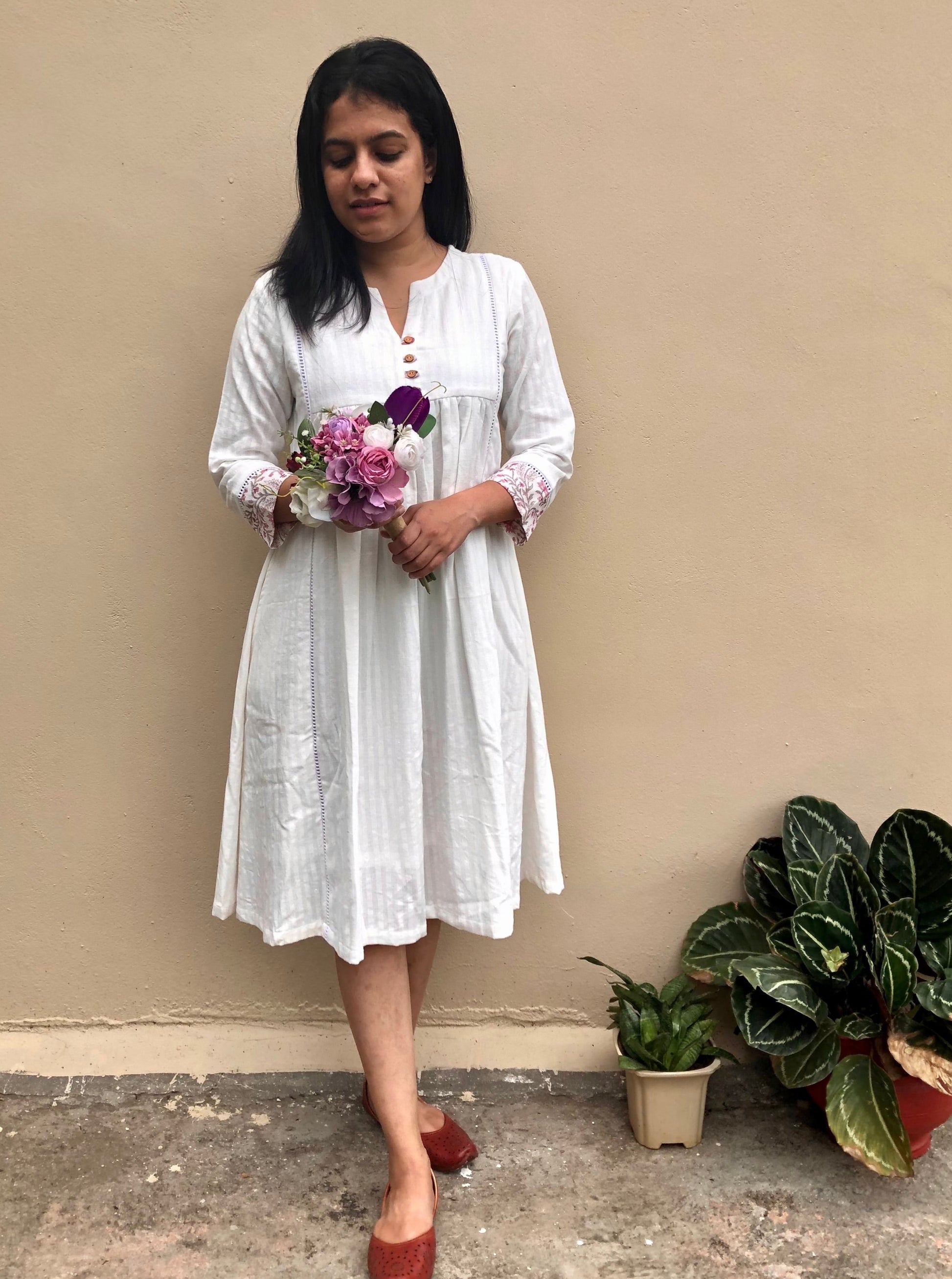 Buy authentic khadi cotton dresses handspun by artisans. This handwoven white khadi dress elevates your summer clothing into elegance. Check out our entire collection!