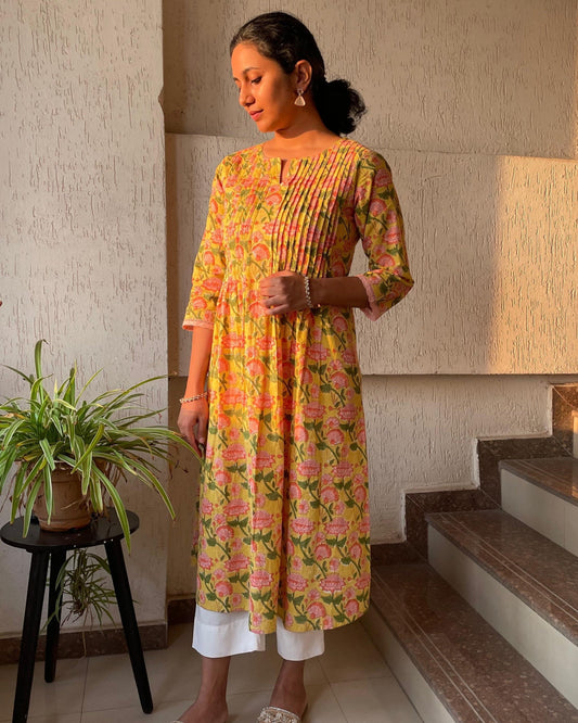 Shop vibrant yellow hand block printed cotton kurta for women. Find unique block print kurtis online. Comfortable, stylish, and perfect for any occasion.