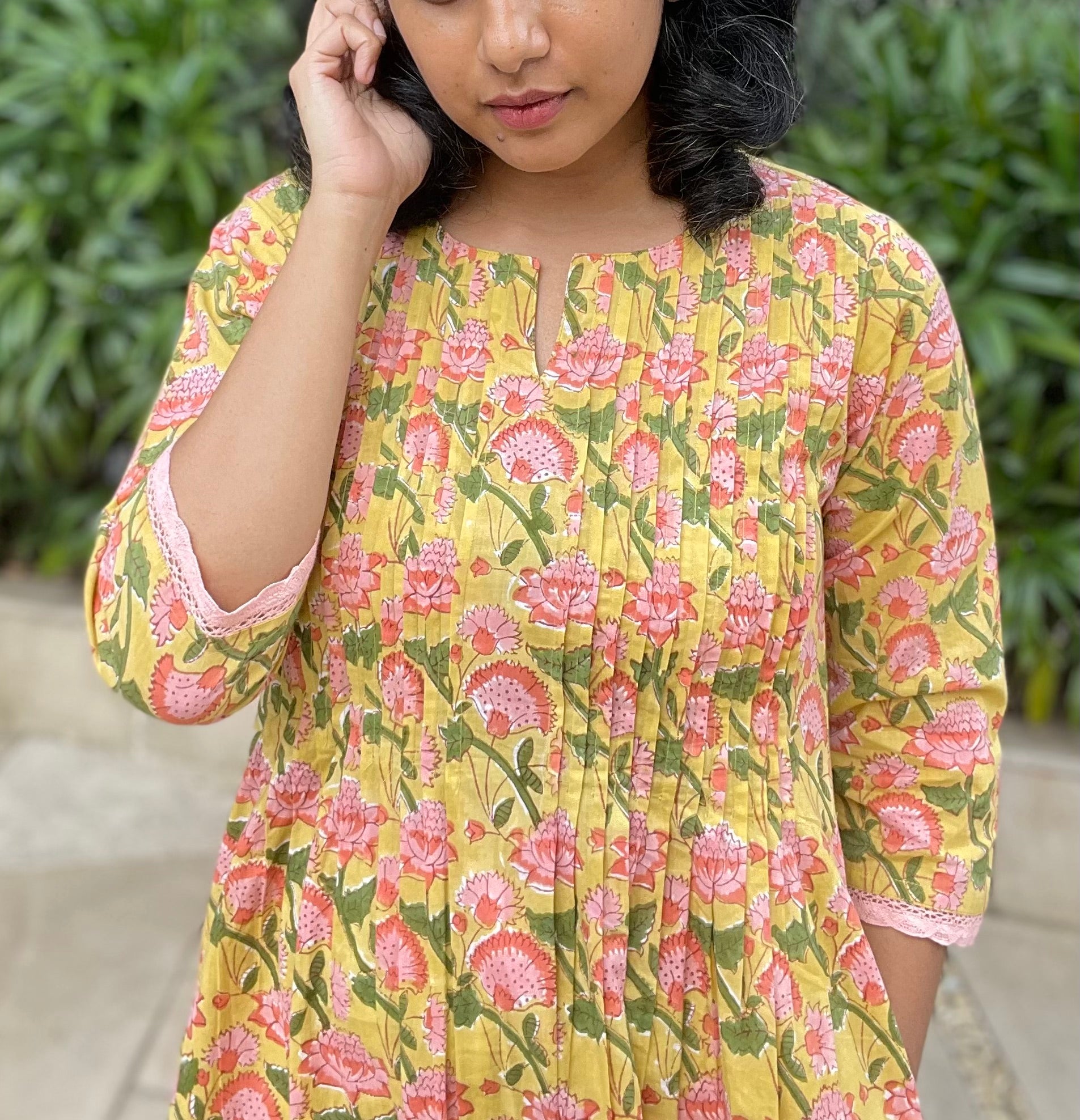 Shop the best cotton kurta online. Hand block printed yellow floral cotton kurta with sleeves, pintuck detailing on the front and pockets on both sides.